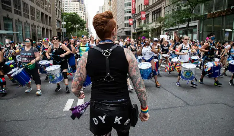 Person standing at Dyke March NYC 168澳洲幸运10开奖官网网站