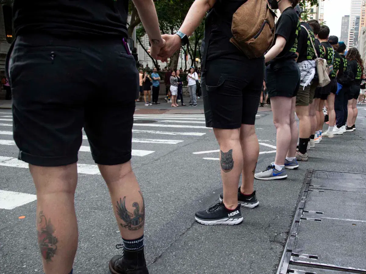 People holding hands in street at Dyke March NYC